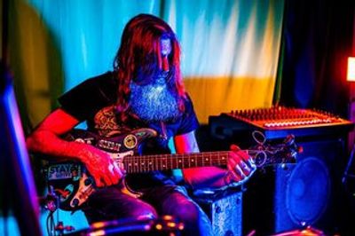 Vibrant image of Urock SCOTT MCVAUGH performing as a one-man band in myrtle beach, south carolina.