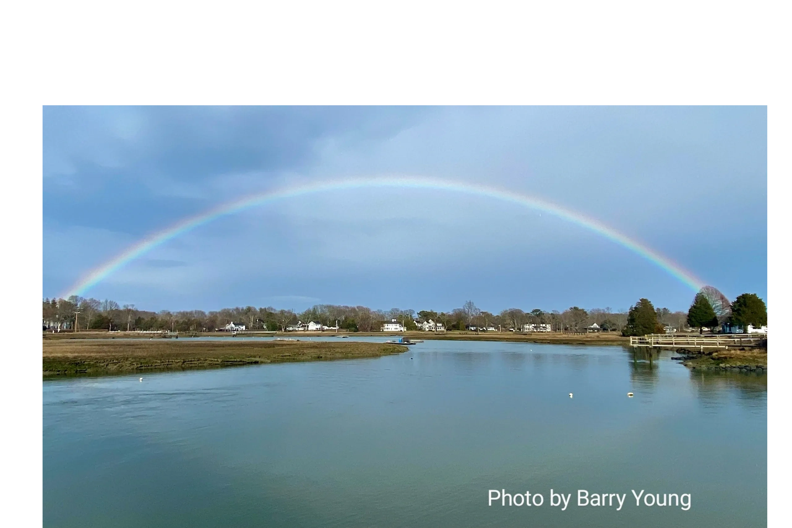 Photo of a rainbow over water in Duxbury