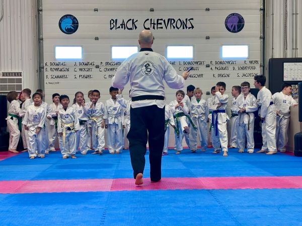 Moose Jaw kids Taekwondo class at Douglas Martial Arts with instructor leading students