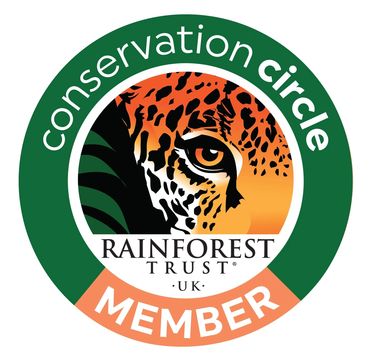 Rainforest Trust UK Conservation Circle Member logo with a jaguar eye.