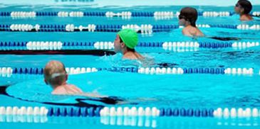 Children competing in a swimming race.