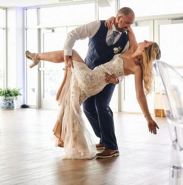 Couple dancing at event venue The Port at Zekes. Wearing a mermaid dress and man wears tuxedo