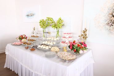 Cake pops, mini cheesecake, cupcakes, cookies for guest to enjoy on this table.