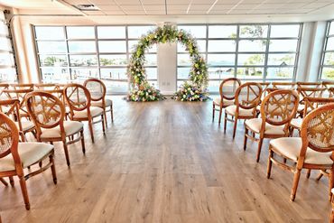 Floral wedding arch for your wedding officiant to ask "Will you take this man.."