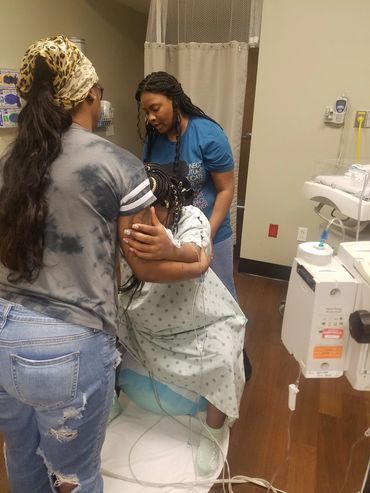 The birthing ball can be used during labor. This Mama used the ball to open the pelvis and hips.