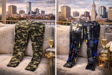 Two pairs of patterned leggings displayed on a couch with city skyline in background.