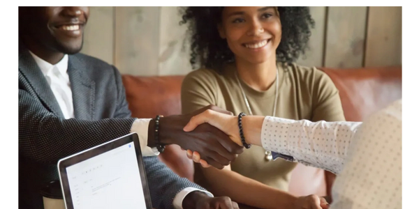 Couple making a real estate investment deal.