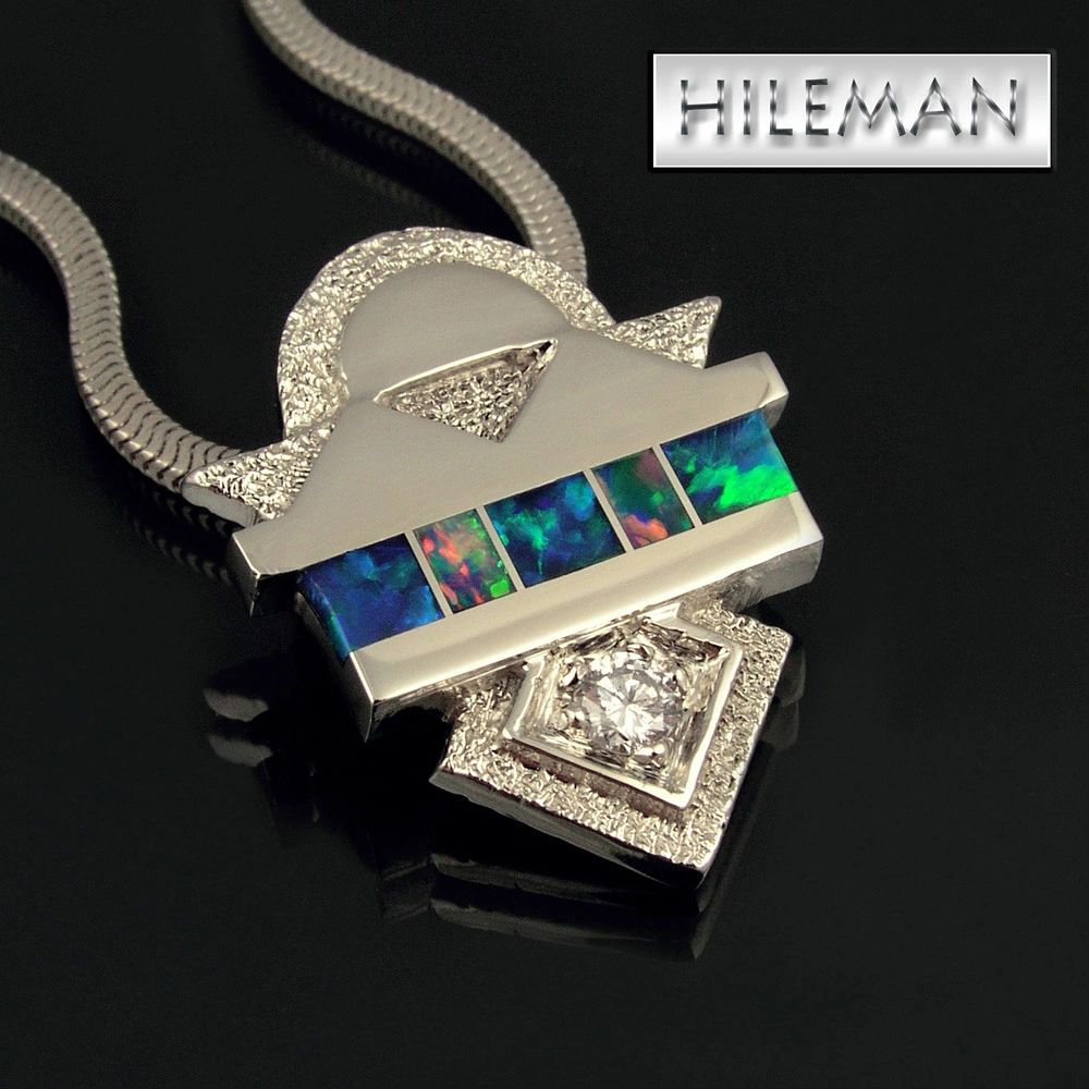 Australian opal inlay pendant with a 10pt. diamond in 14k white gold
