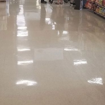 Grocery store section with very shiny floors, after being stripped and waxed.
