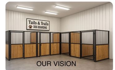 Indoor dog boarding kennels with a sign reading 'Tails & Trails DOG BOARDING'.