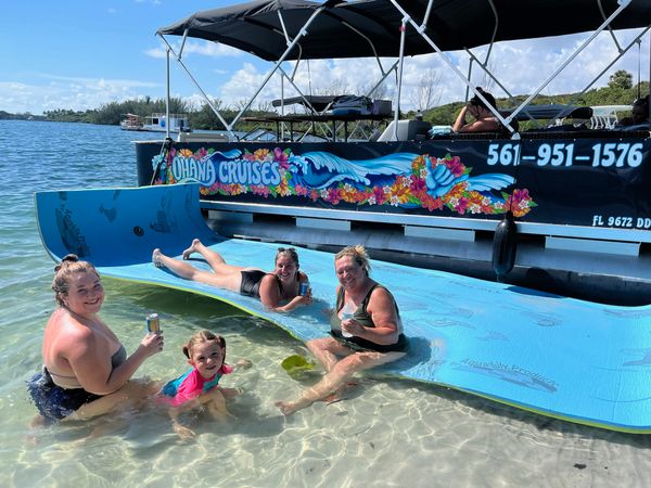 woman laying out at the beach, ohana cruise Lilly pad, high noons