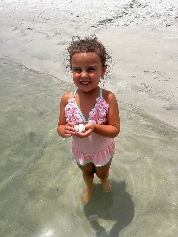 lil girl with seashells, child on beach