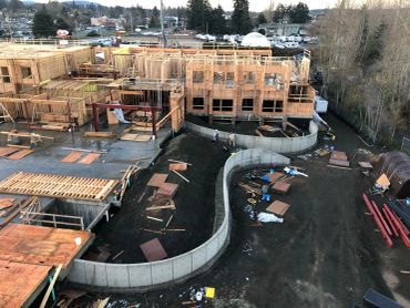 Custom retaining walls that will showcase the exterior patio, stairs and garden space