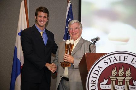 Travis Taliaferro receiving the promising young alumni award 2013 of FSU