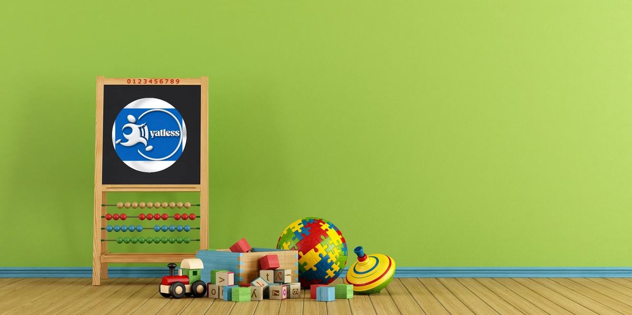 Children's toys and an abacus in a colorful playroom with a green wall.