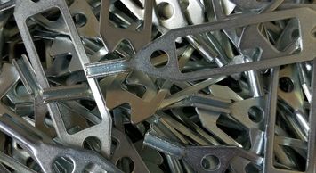 zinc plated steel components used in the automotive industry for self-adjusting drum brake cables