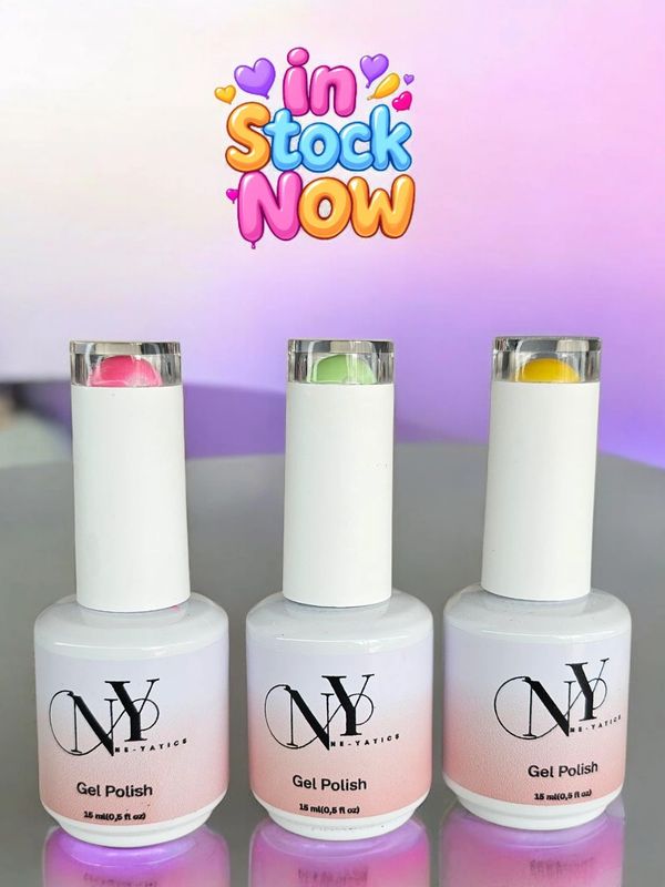 Three bottles of NY gel polish in pink, green, and yellow shades.