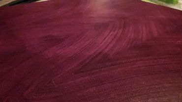 Premium end grain cutting board made of pure purple heart.