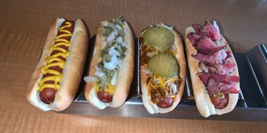 Little hot dogs, mustard dog, cali dog, chili dog, and a pastrami dog