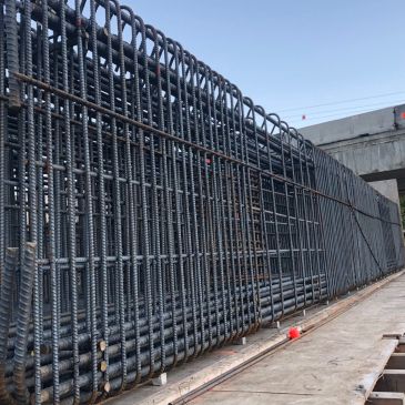 Steel rebar framework at a construction site.