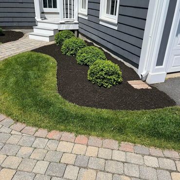 Exceptional lawncare of a yard by Pereira Landscaping in Hudson, MA.