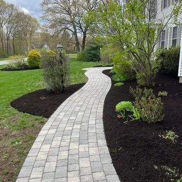 Exceptional lawncare of a yard by Pereira Landscaping in Hudson, MA.