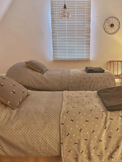 Two massage beds with cushions and blankets set up at Gracie B Salon in West Bridgford, Nottingham