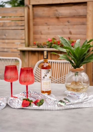 Two red glass with wine on the table