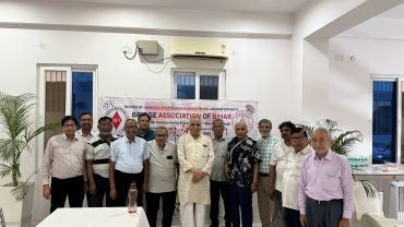 Group photo of men at a Bihari association event.