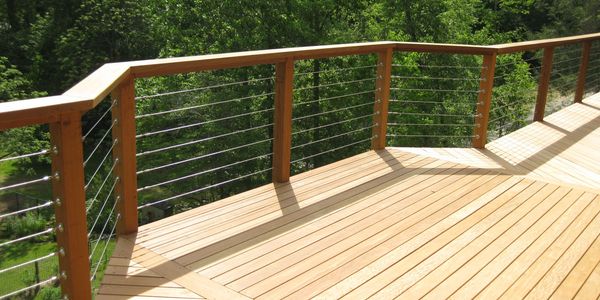 Custom deck featuring "see through" safety railing and a unique flooring design