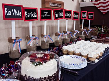 Desserts are lined up at the dessert table.
Specialty cakes and cupcakes are a hit at the event.