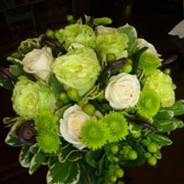A white and light green floral arrangement