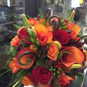 A bunch of orange and red flowers