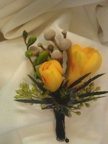 Yellow flowers with a pin