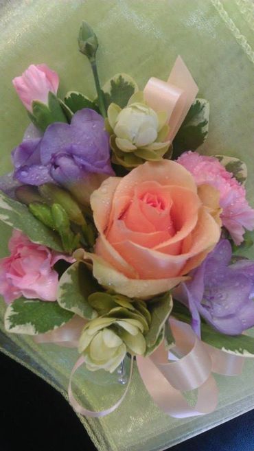 Pink and purple roses with greenery