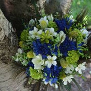 A blue white and green flower bouquet