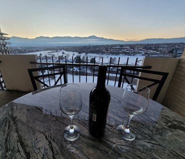 Take in the view while enjoying wine on the balcony