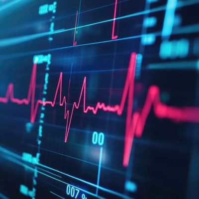 Close-up of a heart monitor display showing a steady heartbeat.