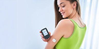 Young woman tests her diabetes.