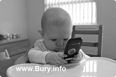 Baby with mobile phone text says bury.info