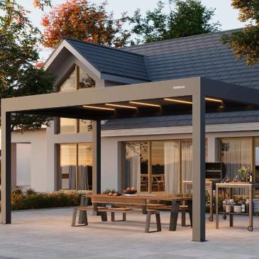 Modern outdoor pergola with integrated lighting beside a contemporary house.