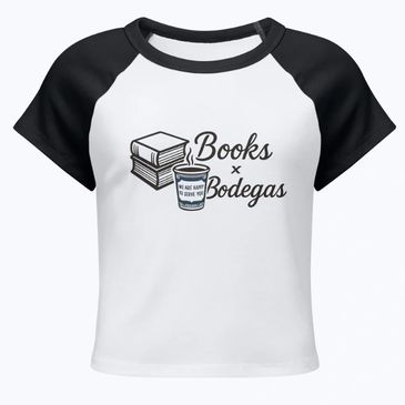 A white and black raglan t-shirt with a books and coffee design.
