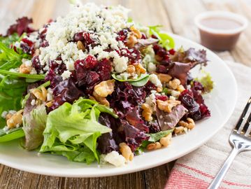 Bistro salad with bacon red onion gorgonzola strawberries and pecans