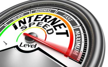 Meter showing internet speed at maximum level with a red needle.