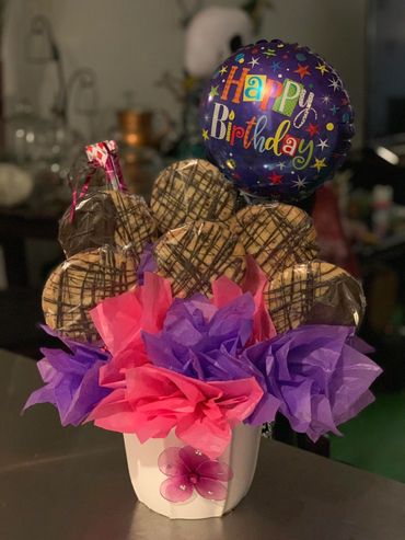 1/2 dz Chocolate chip cookies on a stick with small mylar balloon.