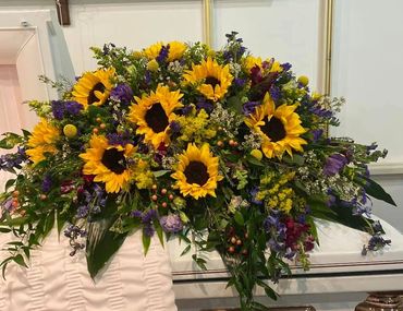 Spray with Sunflowers, Lizzy, assorted wild flower and greens.
