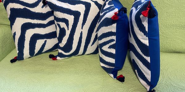      Four new pillows in navy and white zebra-style print of poly/cotton face and 100% cotton backin