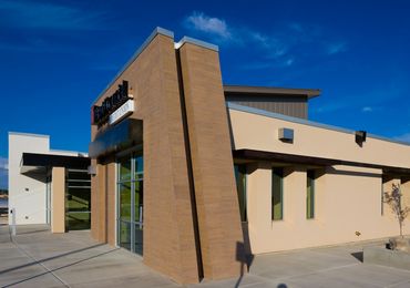 First Financial Credit Union exterior with angled entry wall, clerestory windows, and modern façade.