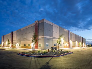 Exterior of the Rio Grande Service Center illuminated at dusk with clean lines and modern design.