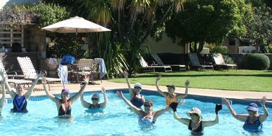 Water Aerobics Clients jumping 